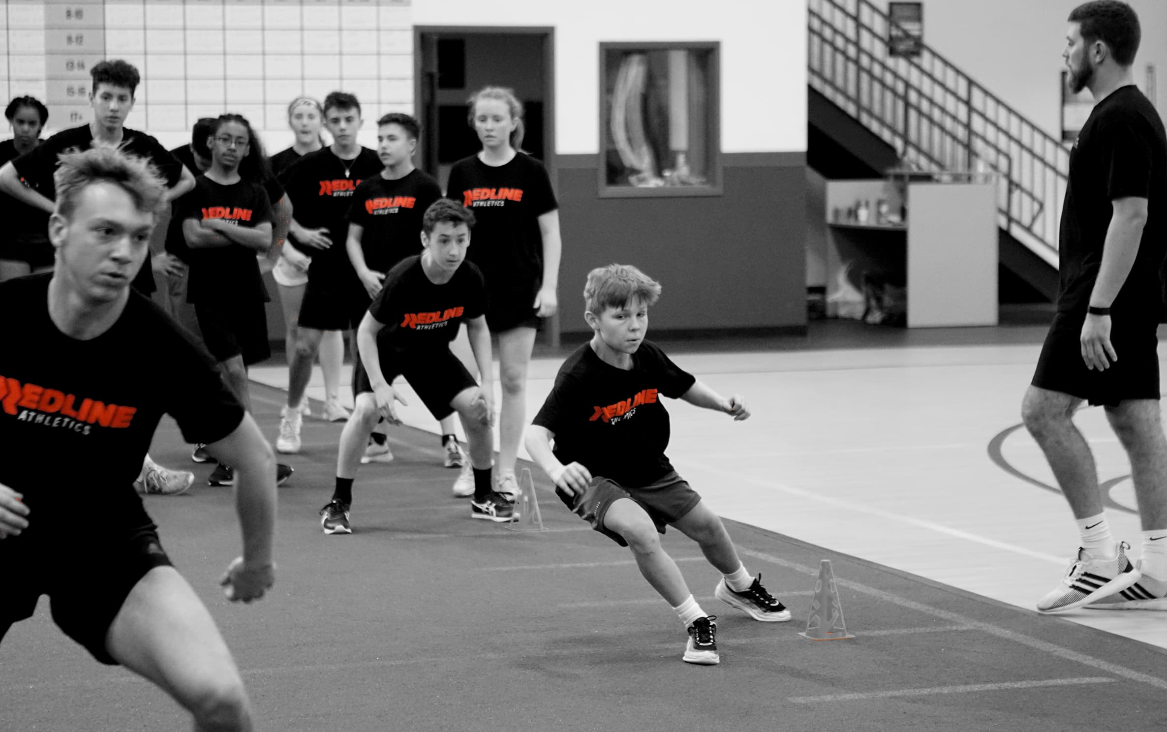 Kids doing drills with a redline coach